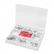 Open white plastic dental instrument case with metal tools and a red label inside the tray lid, arranged in compartments